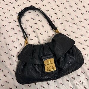 Black and gold embossed Marc Jacobs leather bag